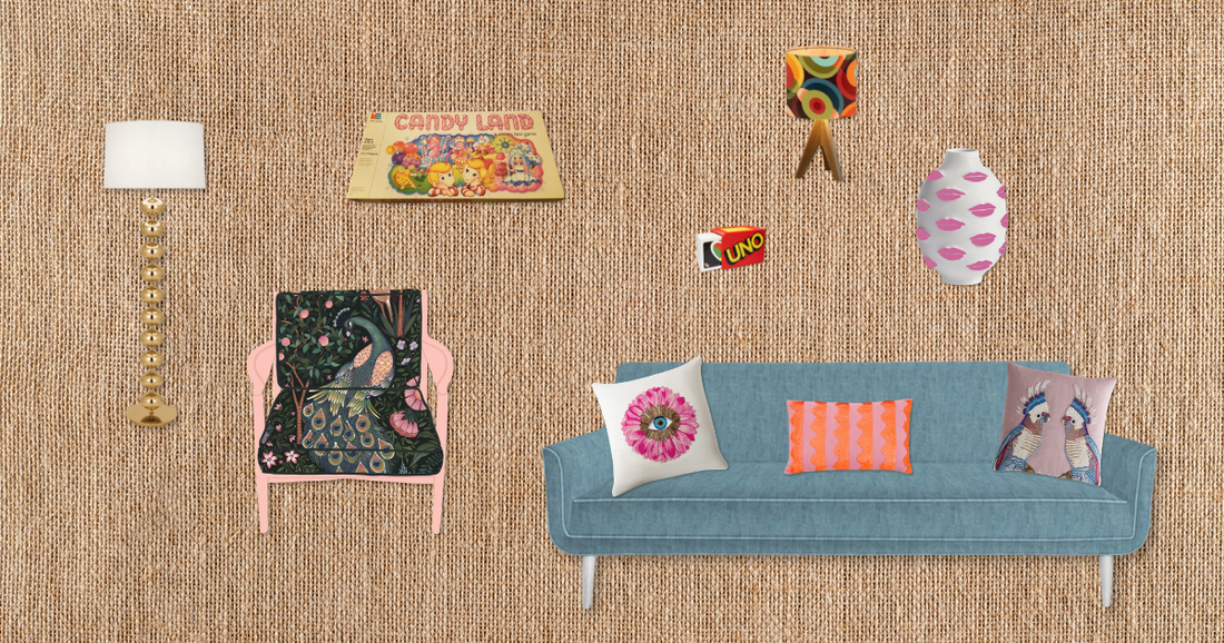 A cozy mid-century inspired living room scene with a teal sofa, pink armchair, brass floor lamp, and nostalgic board games including Candyland and Uno mounted on a textured wall.
